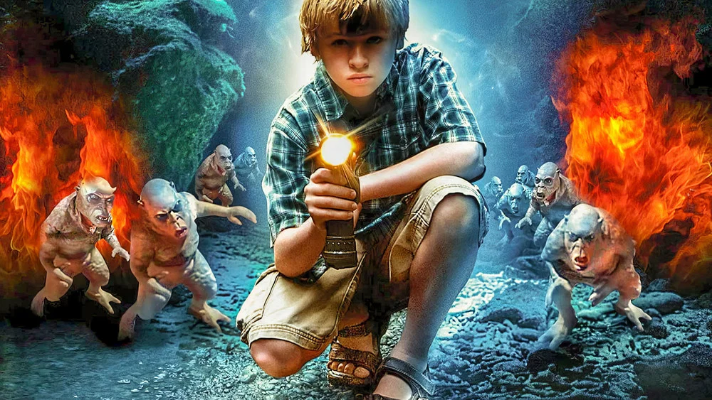 Boy with flashlight facing monsters