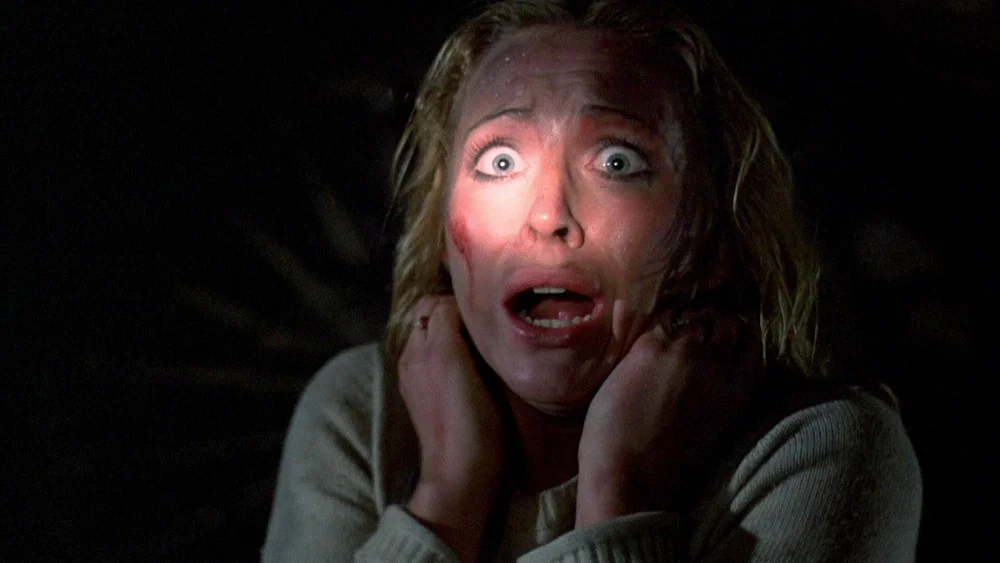 Woman frightened in dark setting